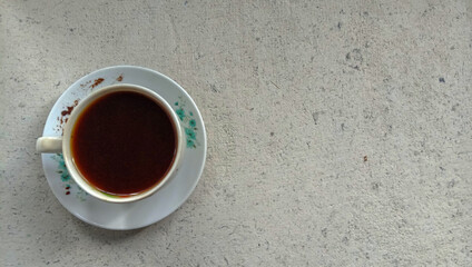 a photo of a cup of black coffee on a flat lay theme