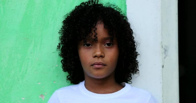 Happy black African child girl smiling at camera portrait face