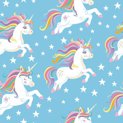 Seamless vector pattern with cute unicorns and stars on blue