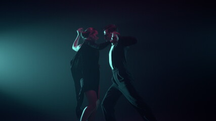 Dancers taking part in competition. Passionate couple performing ballroom dance.
