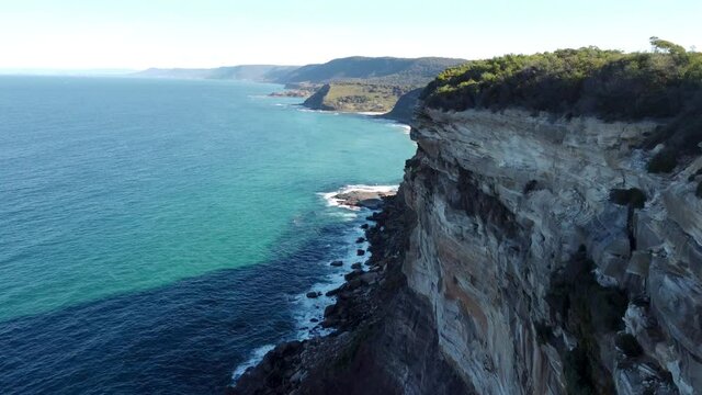 aerial shot of a sea cliff and the ocean on a sunny day. 4K
Royal National Park, NSW Garie beach
