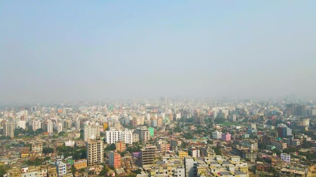 Drone Aerial View of Dhaka, Bangladesh Cityscape and Morning Mist Above Skyline