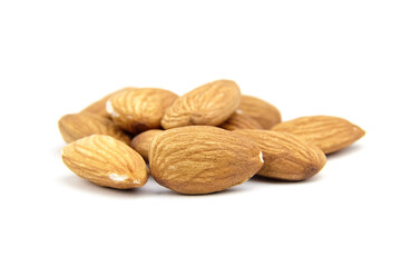 Almond nuts isolated on white background. Heap of peeled almonds