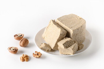 Walnuts halva on white background. Close up.