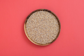 Natural wooden plate with rye seeds