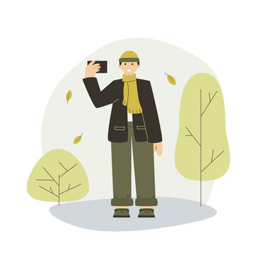Young guy takes a selfie on autumn background. Flat fall concept for web, site, app.  Vector young blogger in the autumn city park. A guy takes a photo against the background of autumn trees.