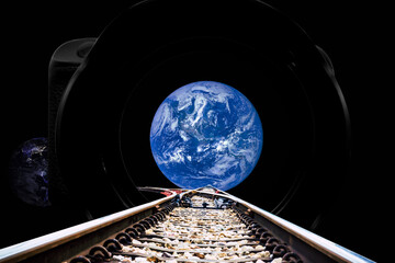 Railroad tracks through the camera to a crossroads, one way to the day world, the other to the night world. Concept of choosing a travel route. Elements of this image furnished by NASA.