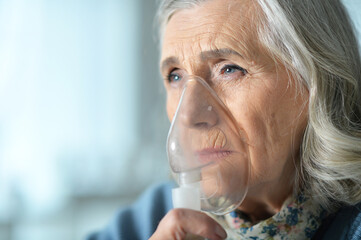 Portrait of senior woman with inhaler