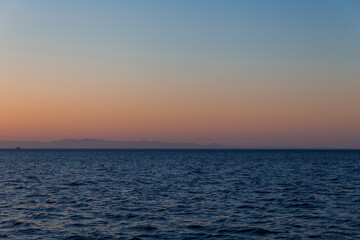 Naklejka na ściany i meble  Sunset horizon view from sea