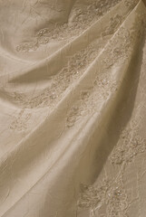 Obraz premium Delicate abstract detail of a wedding dress. Background, texture, embroidered fine lace.