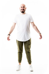 Candid smiling bald bearded stylish hipster in olive chinos. Full body length isolated on white background