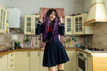 oung brunette girl in the uniform of a Japanese schoolgirl - obrazy, fototapety, plakaty