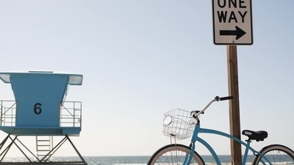 Blue bicycle, cruiser bike by ocean beach, pacific coast sky, Oceanside California USA. Summertime...