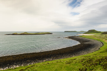 Coral Beach in Claigan, Isle of Skye, Scotland. White coral and black sand. Green grass. The Scottish Highlands.