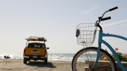 Blue bicycle, cruiser bike by ocean beach pacific coast, Oceanside California USA. Summertime...
