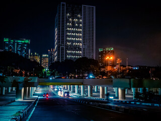 Fototapeta na wymiar The Kemayoran Underpass, located in Kemayoran, Central Jakarta, Indonesia - on June 7, 2021, looks beautiful when seen at night. This underpass is like a rat's path for the residents here, 