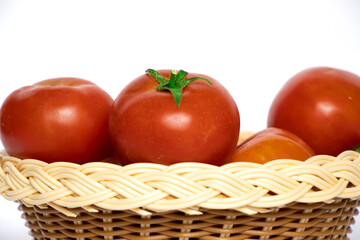 Red Tomato In Wooden Basket