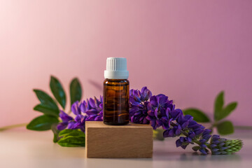 Bottle without label with oil on the stand. Transparent glass container with a dispenser on a beige-pink background. Product banner. Space for text, design.