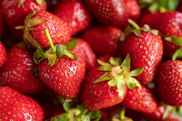 fresh strawberries close-up as background. red background from summer berries. ripe red strawberry