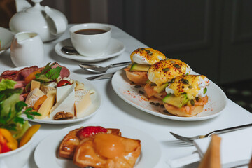 sandwich with salmon and  poached egg