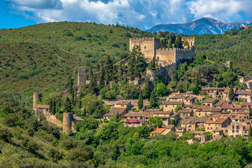 Castelnou village with the Mont canigou in the Background during the springtime - Another one of the Olus Beaux Villages de france - Powered by Adobe