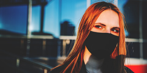 Portrait of a cool young Teenager caucasian girl wearing black mask