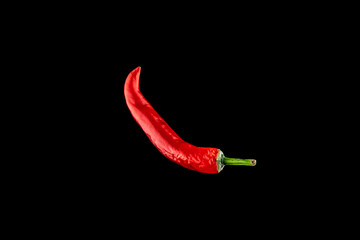 Red hot peppers. Spicy chile cayenne pepper isolated. Red hot chili paprika on black background....