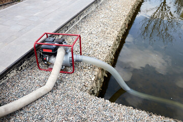 portable pump that pumps water from the pond for watering the garden