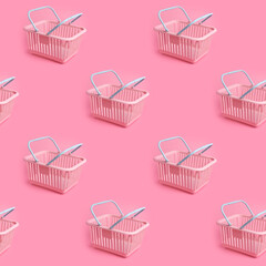 Pattern with pink plastic shopping basket on pink pastel background. Creative minimalist design. Black friday, discount, advertising and sale concept. Trendy minimal design art for poster, branding