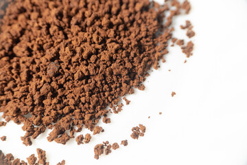 Instant coffee powder on white background with selective focus