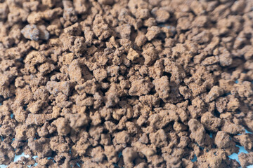 Instant coffee powder on white background with selective focus