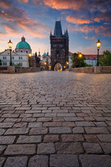 Prague, Charles Bridge. Cityscape image of iconic Charles Bridge with Old Town Bridge Tower in Prague, Czech Republic at sunrise.