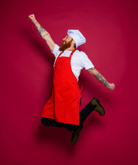 man chef jumps and acts like a super hero