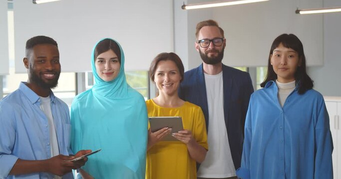 Group portrait of successful multiethnic business team in office