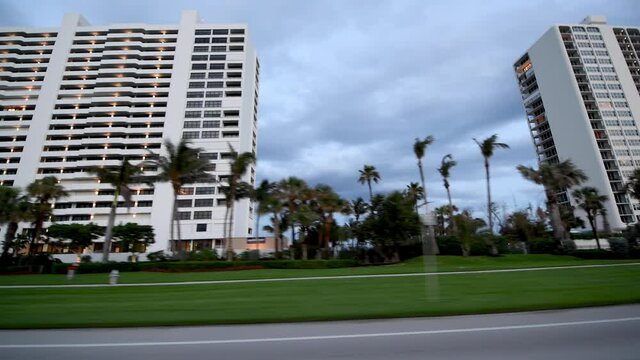Boca Raton buildings as seen from a moving car at sunset, Florida