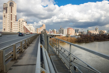 View from the Zhivopisny bridge in Moscow, Russia. It is the highest suspension bridge in Europe and landmark of Moscow. Nice panorama of modern buildings in Moscow.