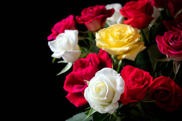 A bouquet of roses on a black background.