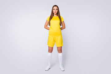 Full body photo of cool lady skilled player soccer team hold hands behind back wear yellow football...