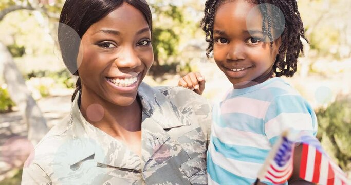 Animation of white circles moving over female soldier embracing smiling son