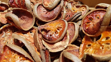 Dried bael fruit background. Close up dried herb. Many of slices of bael fruit .