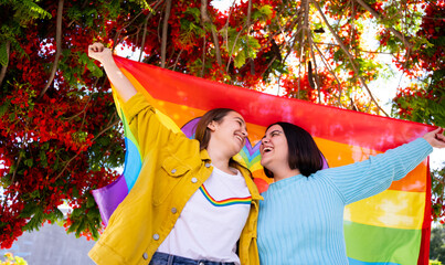 lesbian girls vindicating their love with lgtb flag
