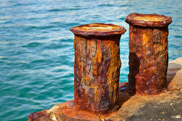 Corrosion of metal. Rusty bollard.