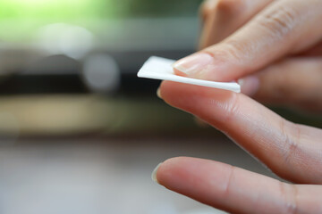 Medicine Health care and people concept - close up of female cleansing finger with alcohol before or after checking blood sugar level by Glucose meter healthy lifestyle medical care hospital concept