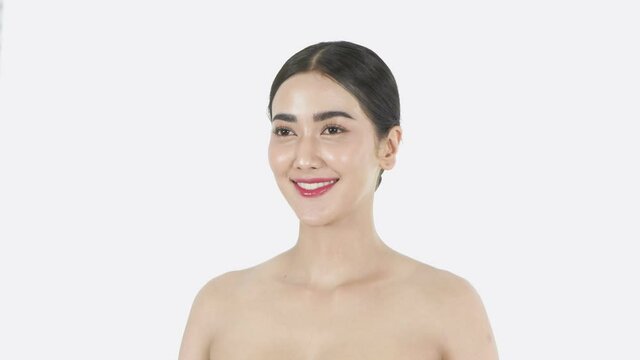 Beauty concept of 4k Resolution. Young Asian woman looking with cheerfulness on a white background.