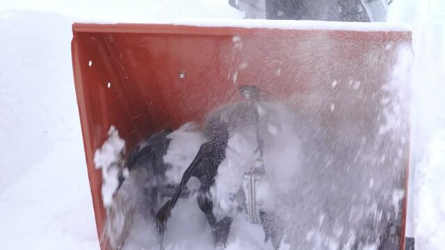 Snow blower auger rotation close up in slow motion
