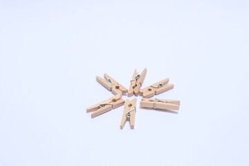 Wooden clips on a white background