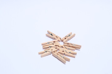 Wooden clips on a white background