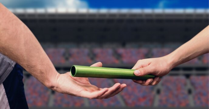 Composition of caucasian athletes passing green relay baton over sports stadium