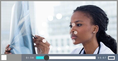 Composition of female doctor on video playback interface screen