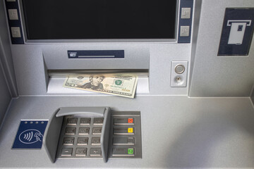 ATM machine with a stuck twenty dollar bill